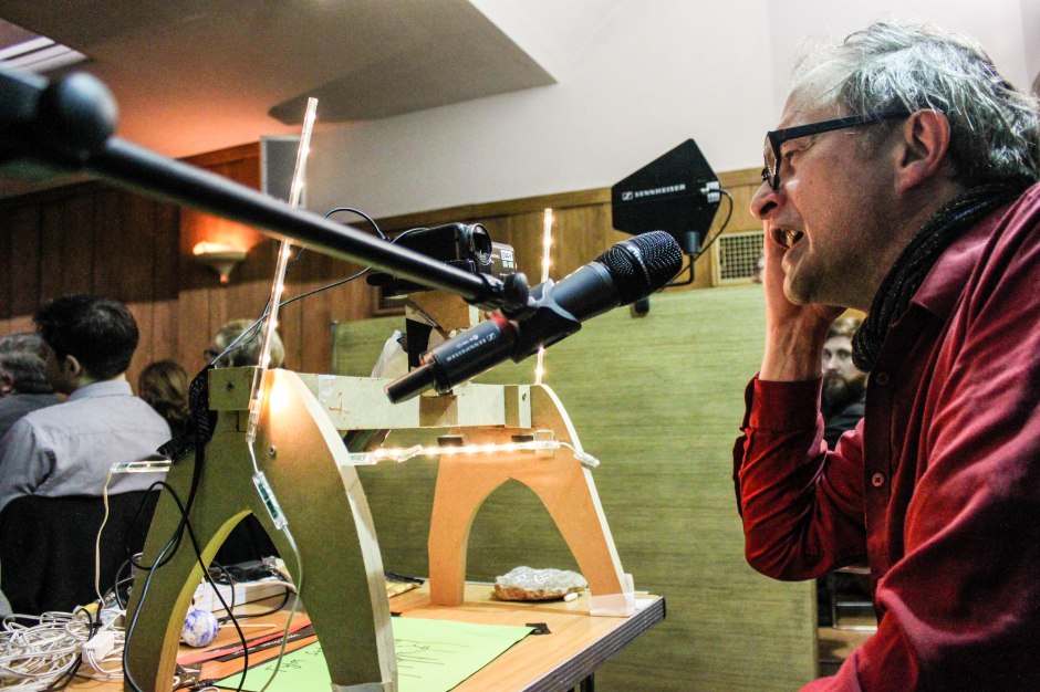 Simon Munnery performing animation and comedy projected live from the back of the Conway Hall